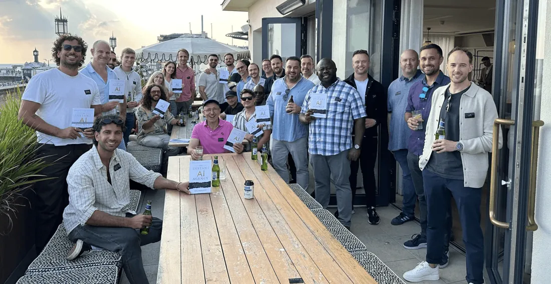 Instant AI Agency members holding the book